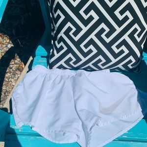 White Nike shorts